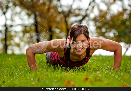 To use this stock image in your creative project, please select the size you need over to the right and click the "Add to Cart" button.
Your downloaded image will come with the Cutcaster watermark removed so don’t worry about the watermark you see on this page. Fitness stock photo, A caucasian female doing push ups in the park by Tyler Olson