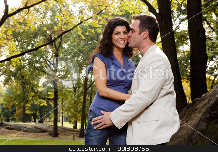 To use this stock image in your creative project, please select the size you need over to the right and click the "Add to Cart" button.
Your downloaded image will come with the Cutcaster watermark removed so don’t worry about the watermark you see on this page. Park Kiss stock photo, A man kissing his girlfriend / wife in the park by Tyler Olson