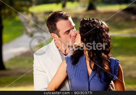 To use this stock image in your creative project, please select the size you need over to the right and click the "Add to Cart" button.
Your downloaded image will come with the Cutcaster watermark removed so don’t worry about the watermark you see on this page. Happy Kiss stock photo, A couple in the park happy and kissing by Tyler Olson