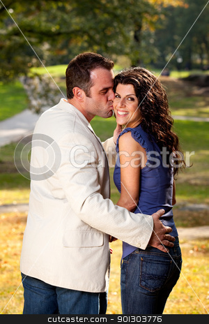 To use this stock image in your creative project, please select the size you need over to the right and click the "Add to Cart" button.
Your downloaded image will come with the Cutcaster watermark removed so don’t worry about the watermark you see on this page. Couple Kiss Park stock photo, A couple kissing with the woman looking at the camera by Tyler Olson