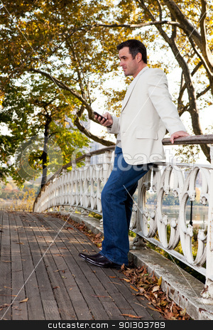 To use this stock image in your creative project, please select the size you need over to the right and click the "Add to Cart" button.
Your downloaded image will come with the Cutcaster watermark removed so don’t worry about the watermark you see on this page. Cell Phone Man stock photo, A man checking his cell phone in a park by Tyler Olson