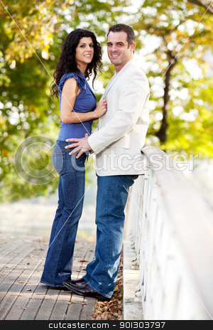To use this stock image in your creative project, please select the size you need over to the right and click the "Add to Cart" button.
Your downloaded image will come with the Cutcaster watermark removed so don’t worry about the watermark you see on this page. Park Couple stock photo, A happy couple in a park on a bridge looking at the camera by Tyler Olson