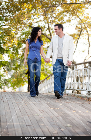 To use this stock image in your creative project, please select the size you need over to the right and click the "Add to Cart" button.
Your downloaded image will come with the Cutcaster watermark removed so don’t worry about the watermark you see on this page. Couple Walk Bridge stock photo, A couple walking on a bridge in a park by Tyler Olson