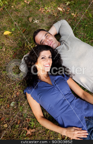 To use this stock image in your creative project, please select the size you need over to the right and click the "Add to Cart" button.
Your downloaded image will come with the Cutcaster watermark removed so don’t worry about the watermark you see on this page. Couple Dream stock photo, A couple in the park laying on the grass. Sharp focus on female. by Tyler Olson