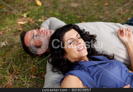 To use this stock image in your creative project, please select the size you need over to the right and click the "Add to Cart" button.
Your downloaded image will come with the Cutcaster watermark removed so don’t worry about the watermark you see on this page. Man Woman Daydream stock photo, A couple laying on grass in a park daydreaming. Focus on the womans eyes by Tyler Olson