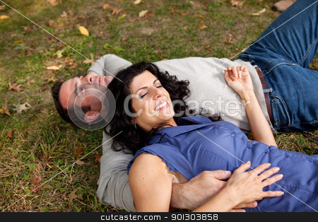 To use this stock image in your creative project, please select the size you need over to the right and click the "Add to Cart" button.
Your downloaded image will come with the Cutcaster watermark removed so don’t worry about the watermark you see on this page. Park Relax stock photo, A couple laying on grass in a park by Tyler Olson