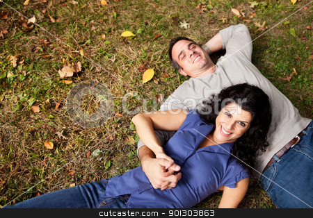 To use this stock image in your creative project, please select the size you need over to the right and click the "Add to Cart" button.
Your downloaded image will come with the Cutcaster watermark removed so don’t worry about the watermark you see on this page. Daydream Park Couple stock photo, A happy couple daydreaming in a park on grass - sharp focus on woman by Tyler Olson