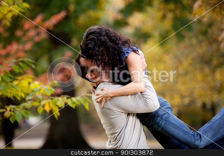 To use this stock image in your creative project, please select the size you need over to the right and click the "Add to Cart" button.
Your downloaded image will come with the Cutcaster watermark removed so don’t worry about the watermark you see on this page. Bear Hug stock photo, A man giving a woman a big hug in a park by Tyler Olson