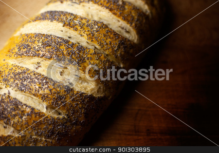 To use this stock image in your creative project, please select the size you need over to the right and click the "Add to Cart" button.
Your downloaded image will come with the Cutcaster watermark removed so don’t worry about the watermark you see on this page. Fresh Bread stock photo, Fresh home-made onion and wild rice bread garnished with poppy seeds with copy space by Tyler Olson