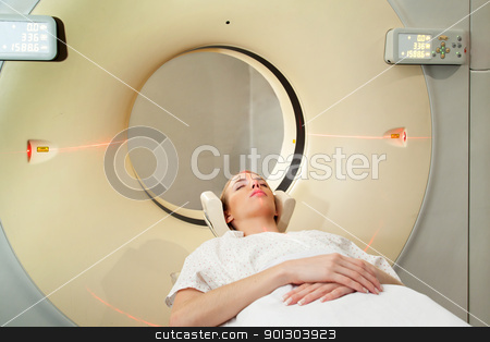 To use this stock image in your creative project, please select the size you need over to the right and click the "Add to Cart" button.
Your downloaded image will come with the Cutcaster watermark removed so don’t worry about the watermark you see on this page. Woman Taking CT Scan stock photo, A young woman undergoing a CT scan in a hospital by Tyler Olson