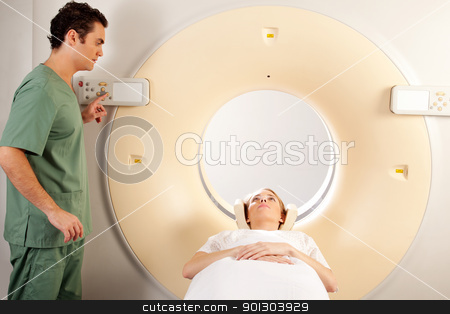 To use this stock image in your creative project, please select the size you need over to the right and click the "Add to Cart" button.
Your downloaded image will come with the Cutcaster watermark removed so don’t worry about the watermark you see on this page. CT Scan Technician stock photo, A CT Scanner Technician preparing a patient for scanning by Tyler Olson