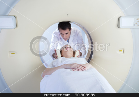 To use this stock image in your creative project, please select the size you need over to the right and click the "Add to Cart" button.
Your downloaded image will come with the Cutcaster watermark removed so don’t worry about the watermark you see on this page. Woman going through CT test stock photo, woman in a ct scan with medical professional by Tyler Olson