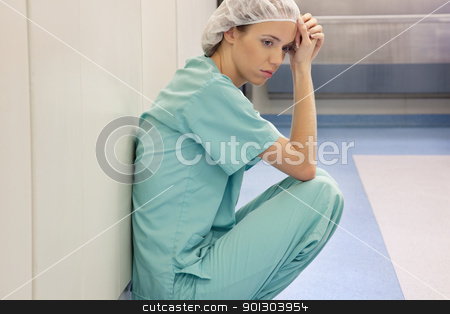 To use this stock image in your creative project, please select the size you need over to the right and click the "Add to Cart" button.
Your downloaded image will come with the Cutcaster watermark removed so don’t worry about the watermark you see on this page. Tired Doctor stock photo, A young tired doctor or nurse after surgery by Tyler Olson