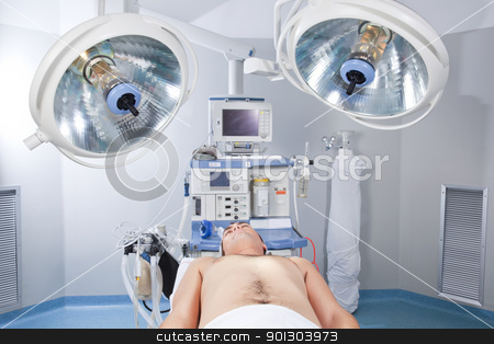 To use this stock image in your creative project, please select the size you need over to the right and click the "Add to Cart" button.
Your downloaded image will come with the Cutcaster watermark removed so don’t worry about the watermark you see on this page. Patient lying unconscious in operation theatre stock photo, Patient lying unconscious before operating in operation theatre by Tyler Olson