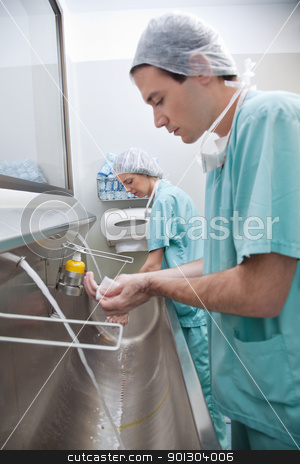 To use this stock image in your creative project, please select the size you need over to the right and click the "Add to Cart" button.
Your downloaded image will come with the Cutcaster watermark removed so don’t worry about the watermark you see on this page. Doctors washing hands stock photo, Doctors washing hands after operation by Tyler Olson