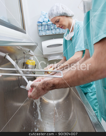 To use this stock image in your creative project, please select the size you need over to the right and click the "Add to Cart" button.
Your downloaded image will come with the Cutcaster watermark removed so don’t worry about the watermark you see on this page. Surgeons washing hands stock photo, Surgeons washing hands before operation by Tyler Olson