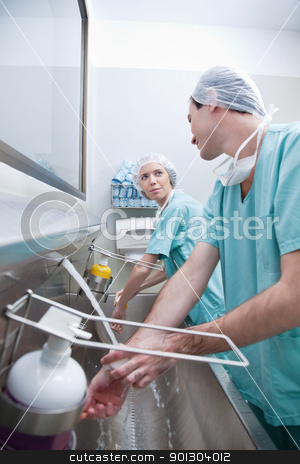 To use this stock image in your creative project, please select the size you need over to the right and click the "Add to Cart" button.
Your downloaded image will come with the Cutcaster watermark removed so don’t worry about the watermark you see on this page. Young surgeons washing hand stock photo, Young surgeons washing hands while talking after operation by Tyler Olson