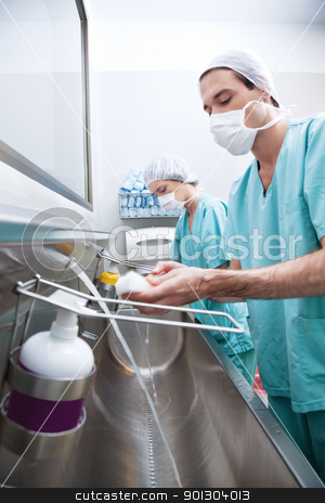 To use this stock image in your creative project, please select the size you need over to the right and click the "Add to Cart" button.
Your downloaded image will come with the Cutcaster watermark removed so don’t worry about the watermark you see on this page. Man and woman washing hands stock photo, Male and female doctor washing hands with hand sanitizer by Tyler Olson