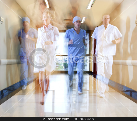 To use this stock image in your creative project, please select the size you need over to the right and click the "Add to Cart" button.
Your downloaded image will come with the Cutcaster watermark removed so don’t worry about the watermark you see on this page. Team of doctor and nurse running stock photo, Team of doctor and nurse running in hallway of hospital by Tyler Olson