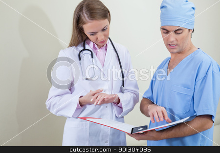 To use this stock image in your creative project, please select the size you need over to the right and click the "Add to Cart" button.
Your downloaded image will come with the Cutcaster watermark removed so don’t worry about the watermark you see on this page. Doctor and nurse reading stock photo, Doctor and nurse reading information from file folder by Tyler Olson