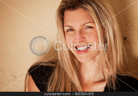 To use this stock image in your creative project, please select the size you need over to the right and click the "Add to Cart" button.
Your downloaded image will come with the Cutcaster watermark removed so don’t worry about the watermark you see on this page. Happy Beautiful Smile stock photo, A casual portrait of a happy beautiful smiling woman by Tyler Olson