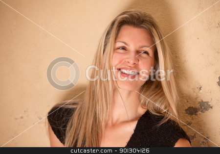 To use this stock image in your creative project, please select the size you need over to the right and click the "Add to Cart" button.
Your downloaded image will come with the Cutcaster watermark removed so don’t worry about the watermark you see on this page. Happy Beautiful Smile stock photo, A casual portrait of a happy beautiful smiling woman by Tyler Olson