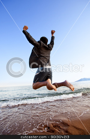 To use this stock image in your creative project, please select the size you need over to the right and click the "Add to Cart" button.
Your downloaded image will come with the Cutcaster watermark removed so don’t worry about the watermark you see on this page. Success Business stock photo, A happy business man jumping by the ocean - happy successful concept by Tyler Olson