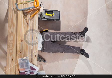 To use this stock image in your creative project, please select the size you need over to the right and click the "Add to Cart" button.
Your downloaded image will come with the Cutcaster watermark removed so don’t worry about the watermark you see on this page. Men working with tools stock photo, Man working under the wooden plank with tools by Tyler Olson