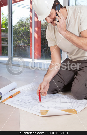 To use this stock image in your creative project, please select the size you need over to the right and click the "Add to Cart" button.
Your downloaded image will come with the Cutcaster watermark removed so don’t worry about the watermark you see on this page. Architect working on blueprint stock photo, Architect working on blueprint and talking on cellphone by Tyler Olson