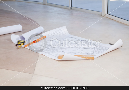 To use this stock image in your creative project, please select the size you need over to the right and click the "Add to Cart" button.
Your downloaded image will come with the Cutcaster watermark removed so don’t worry about the watermark you see on this page. Blueprint on the floor stock photo, Blueprint on the floor with measuring tape and ruler by Tyler Olson