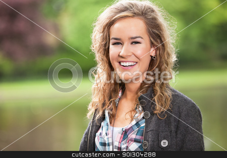 To use this stock image in your creative project, please select the size you need over to the right and click the "Add to Cart" button.
Your downloaded image will come with the Cutcaster watermark removed so don’t worry about the watermark you see on this page. Young female smiling outdoors stock photo, Beautiful young woman smiling outdoors in park by Tyler Olson