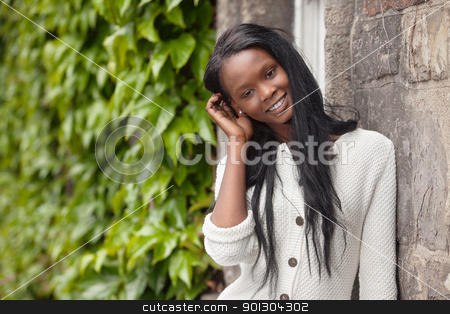 To use this stock image in your creative project, please select the size you need over to the right and click the "Add to Cart" button.
Your downloaded image will come with the Cutcaster watermark removed so don’t worry about the watermark you see on this page. Young African American woman standing and smiling stock photo, Happy young African American woman standing outdoors and smiling by Tyler Olson