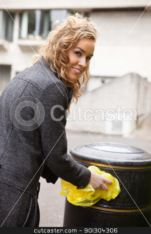 To use this stock image in your creative project, please select the size you need over to the right and click the "Add to Cart" button.
Your downloaded image will come with the Cutcaster watermark removed so don’t worry about the watermark you see on this page. Happy woman putting plastic waste in garbage bin stock photo, Portrait of smiling young woman putting plastic waste in garbage bin by street by Tyler Olson