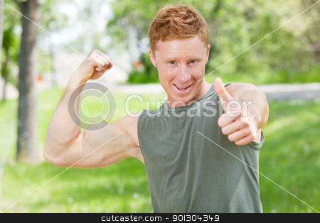 To use this stock image in your creative project, please select the size you need over to the right and click the "Add to Cart" button.
Your downloaded image will come with the Cutcaster watermark removed so don’t worry about the watermark you see on this page. Man flexing and showing thumbs-up sign stock photo, Handsome man showing thumbs up sign while flexing by Tyler Olson