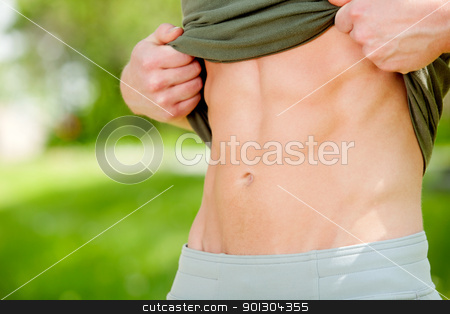 To use this stock image in your creative project, please select the size you need over to the right and click the "Add to Cart" button.
Your downloaded image will come with the Cutcaster watermark removed so don’t worry about the watermark you see on this page. Close-up of man's mid section stock photo, Sexy man showing his six-packs against blur background by Tyler Olson