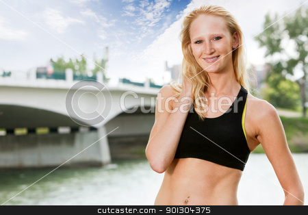 To use this stock image in your creative project, please select the size you need over to the right and click the "Add to Cart" button.
Your downloaded image will come with the Cutcaster watermark removed so don’t worry about the watermark you see on this page. Portrait of woman in sportswear stock photo, Portrait of beautiful woman smiling near bridge by Tyler Olson