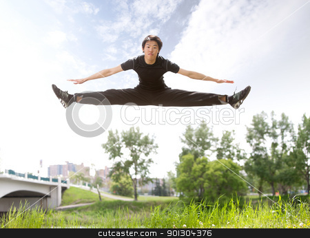 To use this stock image in your creative project, please select the size you need over to the right and click the "Add to Cart" button.
Your downloaded image will come with the Cutcaster watermark removed so don’t worry about the watermark you see on this page. Man jumping in the air stock photo, Young man jumping in the air near bridge under clear sky by Tyler Olson