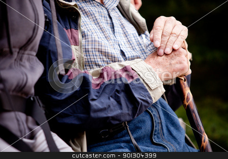 To use this stock image in your creative project, please select the size you need over to the right and click the "Add to Cart" button.
Your downloaded image will come with the Cutcaster watermark removed so don’t worry about the watermark you see on this page. Elderly Man Outdoor stock photo, A detail of an elderly man outdoors with a walking stick by Tyler Olson