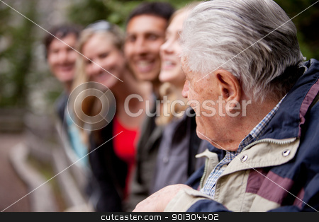 To use this stock image in your creative project, please select the size you need over to the right and click the "Add to Cart" button.
Your downloaded image will come with the Cutcaster watermark removed so don’t worry about the watermark you see on this page. Elderly Guide stock photo, An elderly man guiding a group of young people in the forest by Tyler Olson