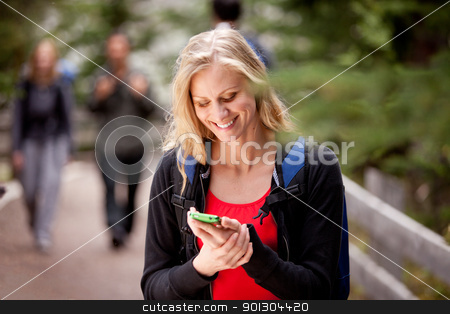 To use this stock image in your creative project, please select the size you need over to the right and click the "Add to Cart" button.
Your downloaded image will come with the Cutcaster watermark removed so don’t worry about the watermark you see on this page. Woman Text Phone stock photo, A young woman reading a friendly text while outdoors by Tyler Olson
