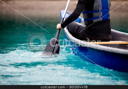 To use this stock image in your creative project, please select the size you need over to the right and click the "Add to Cart" button.
Your downloaded image will come with the Cutcaster watermark removed so don’t worry about the watermark you see on this page. Canoe Paddle Detail stock photo, A person paddling a canoe in a turquoise galcier water by Tyler Olson