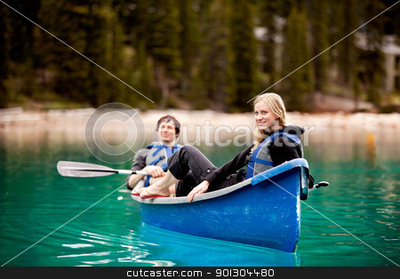 To use this stock image in your creative project, please select the size you need over to the right and click the "Add to Cart" button.
Your downloaded image will come with the Cutcaster watermark removed so don’t worry about the watermark you see on this page. Couple Relaxing in a Canoe stock photo, A happy couple relaxing in a canoe on a glacial lake by Tyler Olson