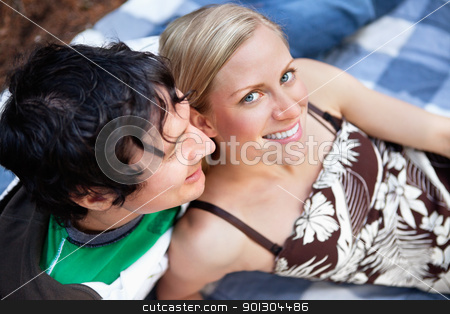 To use this stock image in your creative project, please select the size you need over to the right and click the "Add to Cart" button.
Your downloaded image will come with the Cutcaster watermark removed so don’t worry about the watermark you see on this page. Young couple relaxing on picnic blanket stock photo, Top view close-up of young man and woman relaxing on picnic blanket by Tyler Olson