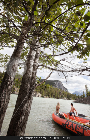 To use this stock image in your creative project, please select the size you need over to the right and click the "Add to Cart" button.
Your downloaded image will come with the Cutcaster watermark removed so don’t worry about the watermark you see on this page. Couple enjoying their vacation stock photo, Young couple in raft looking at view by Tyler Olson