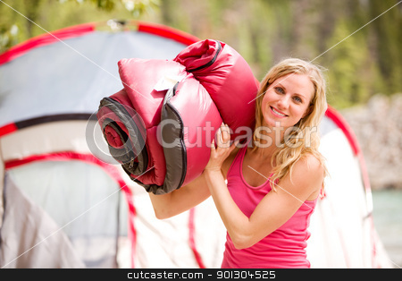 To use this stock image in your creative project, please select the size you need over to the right and click the "Add to Cart" button.
Your downloaded image will come with the Cutcaster watermark removed so don’t worry about the watermark you see on this page. Woman with Sleeping Bag stock photo, A portrait of a woman holding a sleeping bag by Tyler Olson