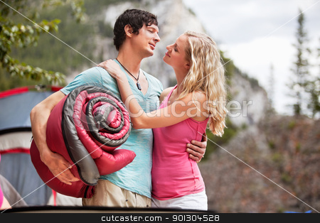 To use this stock image in your creative project, please select the size you need over to the right and click the "Add to Cart" button.
Your downloaded image will come with the Cutcaster watermark removed so don’t worry about the watermark you see on this page. Romantic couple with sleeping bag while camping stock photo, Young woman carrying sleeping bag and embracing woman while camping by Tyler Olson