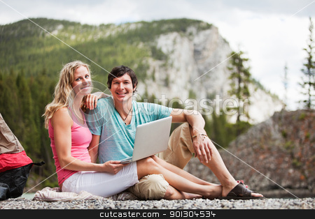 To use this stock image in your creative project, please select the size you need over to the right and click the "Add to Cart" button.
Your downloaded image will come with the Cutcaster watermark removed so don’t worry about the watermark you see on this page. Relaxed couple with laptop while camping stock photo, Portrait of happy relaxed young couple with laptop while camping by Tyler Olson