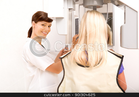 To use this stock image in your creative project, please select the size you need over to the right and click the "Add to Cart" button.
Your downloaded image will come with the Cutcaster watermark removed so don’t worry about the watermark you see on this page. Dental X-ray Machine stock photo, A woman taking a panoramic digital x-ray of a patients teeth by Tyler Olson