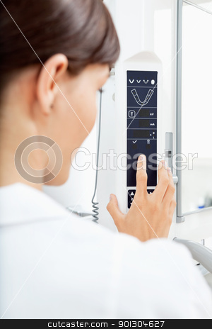 To use this stock image in your creative project, please select the size you need over to the right and click the "Add to Cart" button.
Your downloaded image will come with the Cutcaster watermark removed so don’t worry about the watermark you see on this page. X-ray Machine Detail stock photo, A detail of a young woman using a panormaic digital X-ray machine by Tyler Olson