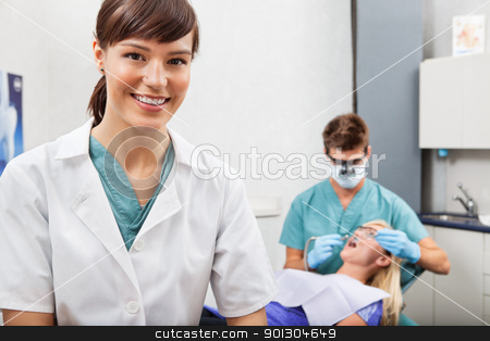 To use this stock image in your creative project, please select the size you need over to the right and click the "Add to Cart" button.
Your downloaded image will come with the Cutcaster watermark removed so don’t worry about the watermark you see on this page. Assistant with dentistry work in the background stock photo, Portrait of dental assistant smiling with dentistry work in the background by Tyler Olson